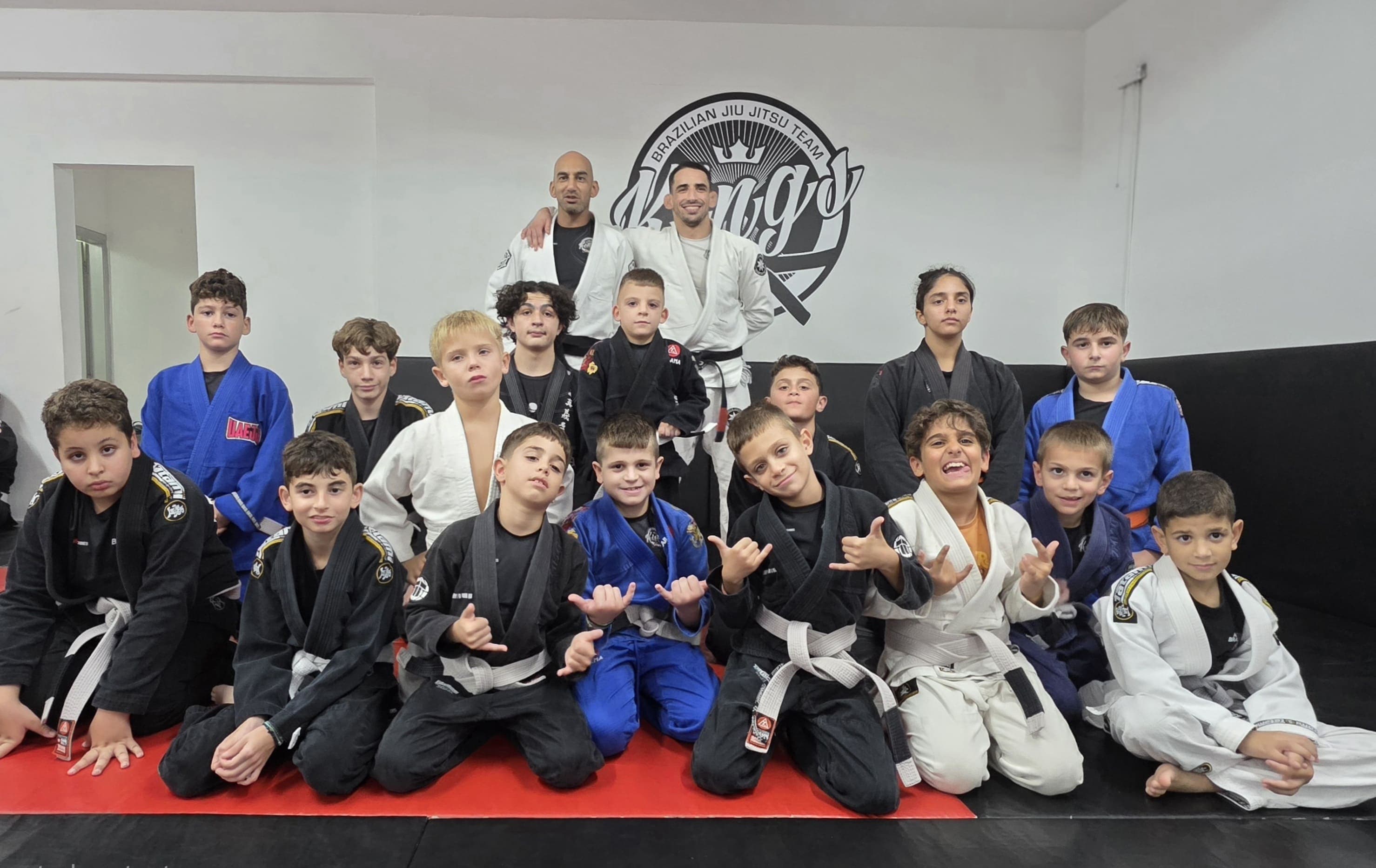 Members of our BJJ community in Paphos, Cyprus, posing as a team, showcasing our BJJ academy's camaraderie and unity.