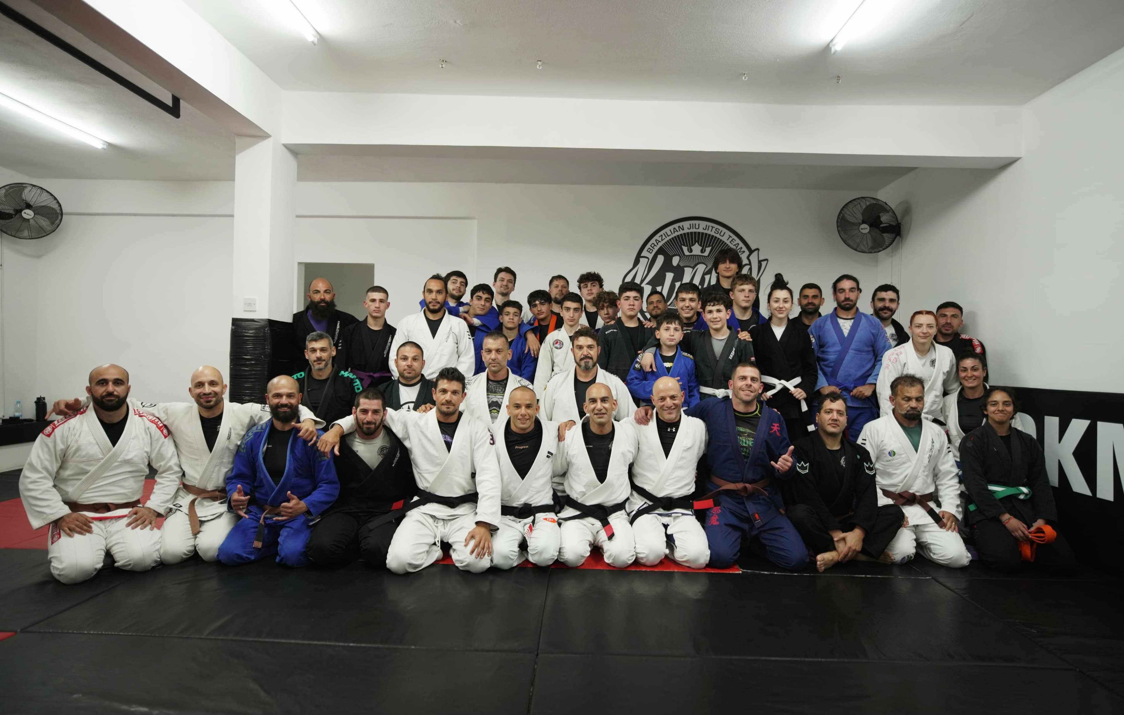 Our little champions from the BJJ gym in Paphos, Cyprus, standing proudly as a team, symbolizing the spirit of youth empowerment in BJJ.